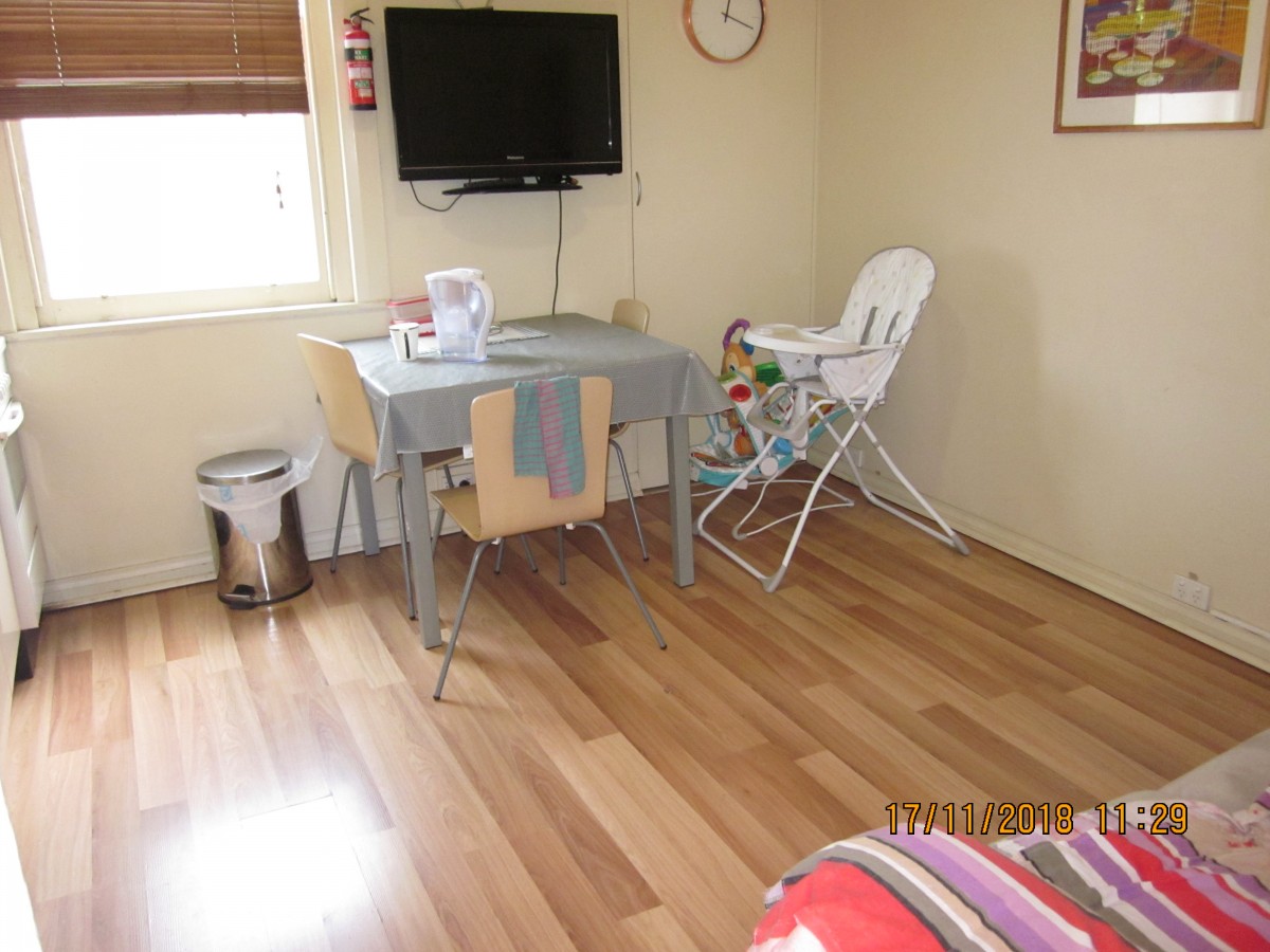 photo living area.with baby chairJPG.JPG